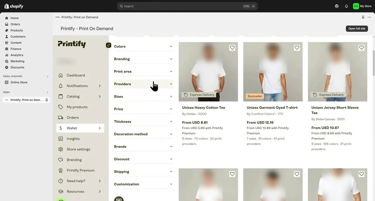 Printify catalog inside Shopify with filters on the left including Providers, and shirt cards with blurred model faces for the Gildan 5000, Comfort Colors 1717 and Bella+Canvas 3001, each showing a from price, a price with Printify Premium, and the number of print providers