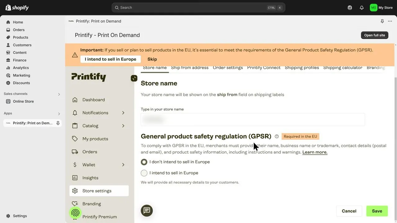 Printify Store settings inside the Shopify admin with a Store name box whose entry is blurred, and a General product safety regulation section marked Required in the EU with two choices, I don't intend to sell in Europe and I intend to sell in Europe